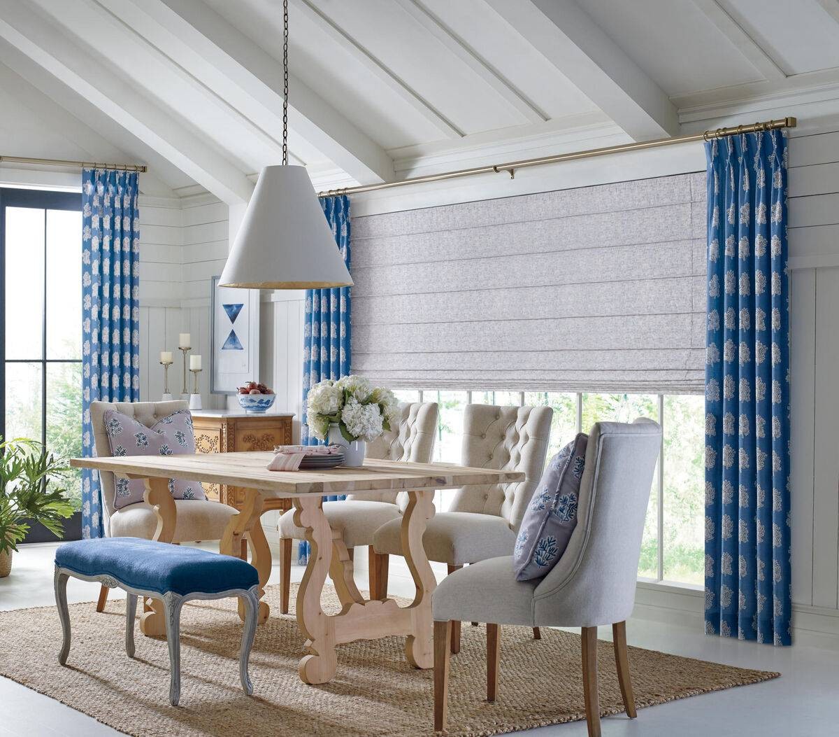 Hunter Douglas Roman Shades layered with curtains in a home near Marriottsville, MD